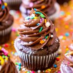 Close up photo of Chocolate Cupcakes on a copper baking sheet.