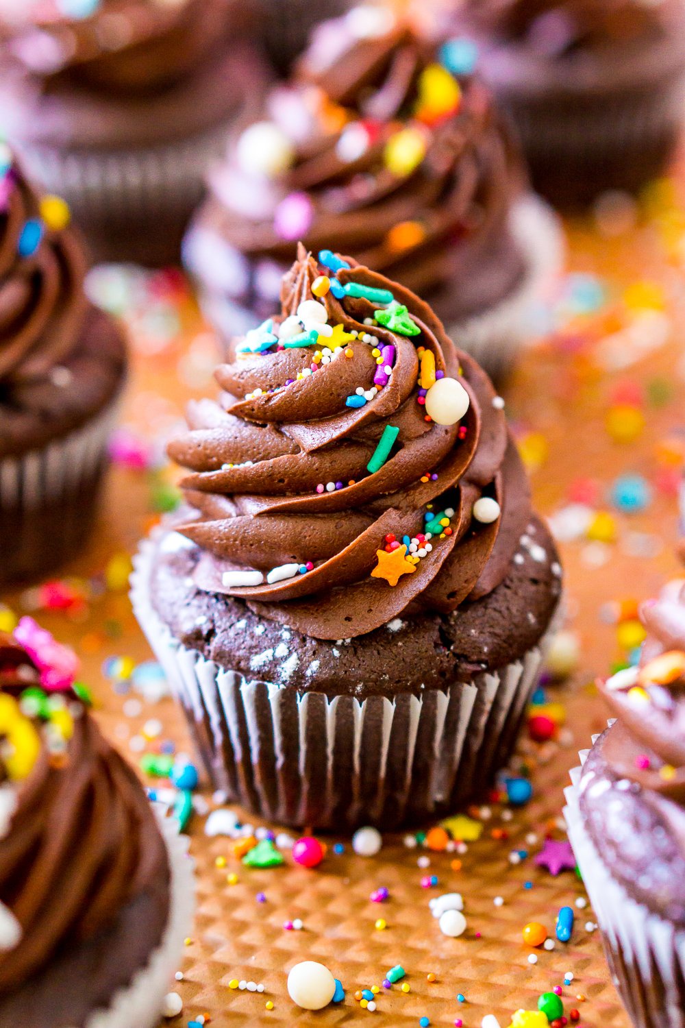 Close up photo of Chocolate Cupcakes on a copper baking sheet.