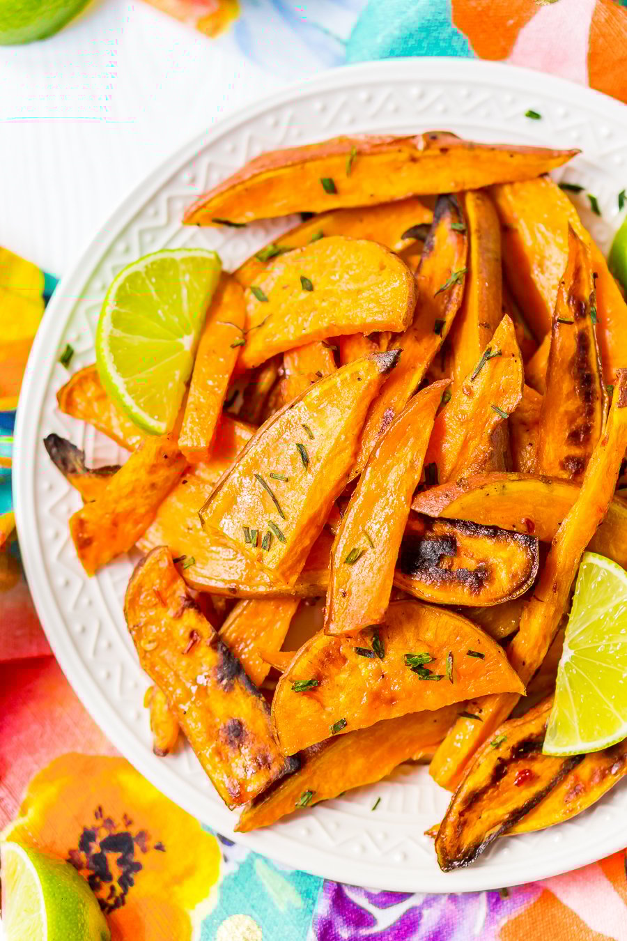 Chile Lime Sweet Potato Wedges are lighter than fries and potato skins, but just as delicious. With a squeeze of lime, a dash of garlic, and a kick of chile, this side is so flavorful, you won’t miss the extra calories!