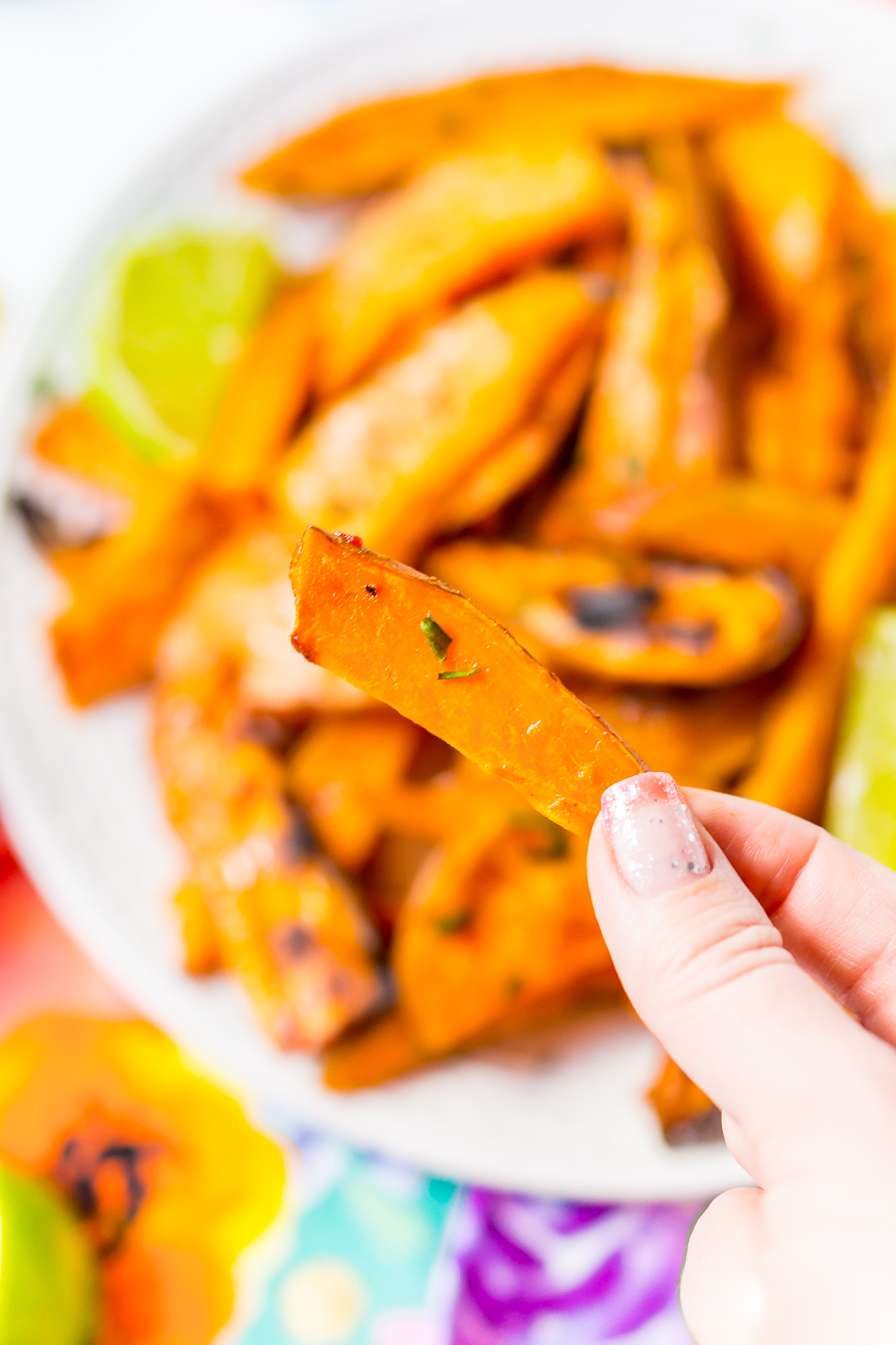 Chile Lime Sweet Potato Wedges are lighter than fries and potato skins, but just as delicious. With a squeeze of lime, a dash of garlic, and a kick of chile, this side is so flavorful, you won’t miss the extra calories!