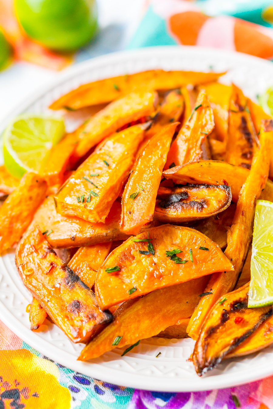 Chile Lime Sweet Potato Wedges are lighter than fries and potato skins, but just as delicious. With a squeeze of lime, a dash of garlic, and a kick of chile, this side is so flavorful, you won’t miss the extra calories!