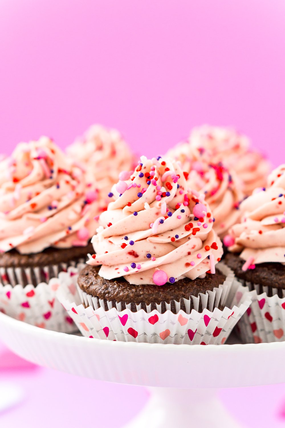 These Strawberry Chocolate Cupcakes are a delicious blend of rich chocolate cake and sweet strawberry whipped cream frosting! Perfect for Valentine's Day, Baby Showers, Bridal Showers, and more!