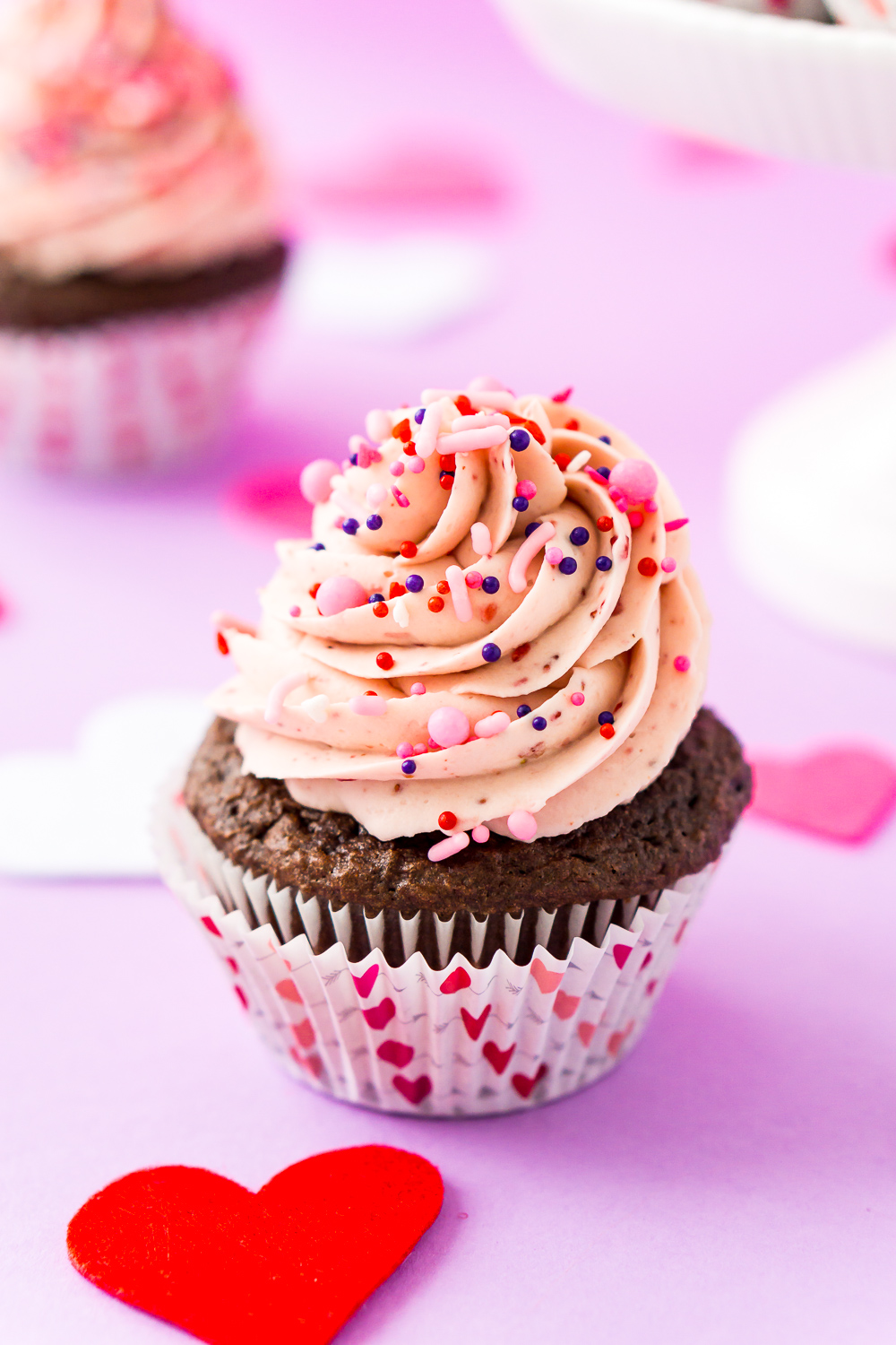 These Strawberry Chocolate Cupcakes are a delicious blend of rich chocolate cake and sweet strawberry whipped cream frosting! Perfect for Valentine's Day, Baby Showers, Bridal Showers, and more!