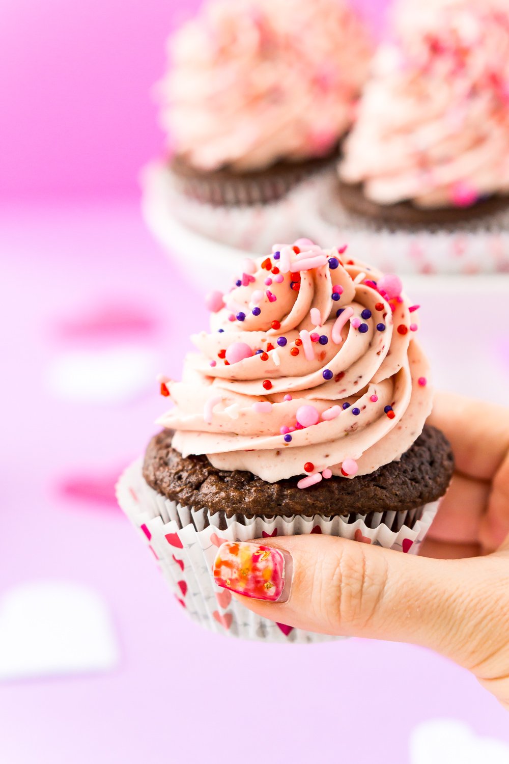 These Strawberry Chocolate Cupcakes are a delicious blend of rich chocolate cake and sweet strawberry whipped cream frosting! Perfect for Valentine's Day, Baby Showers, Bridal Showers, and more!