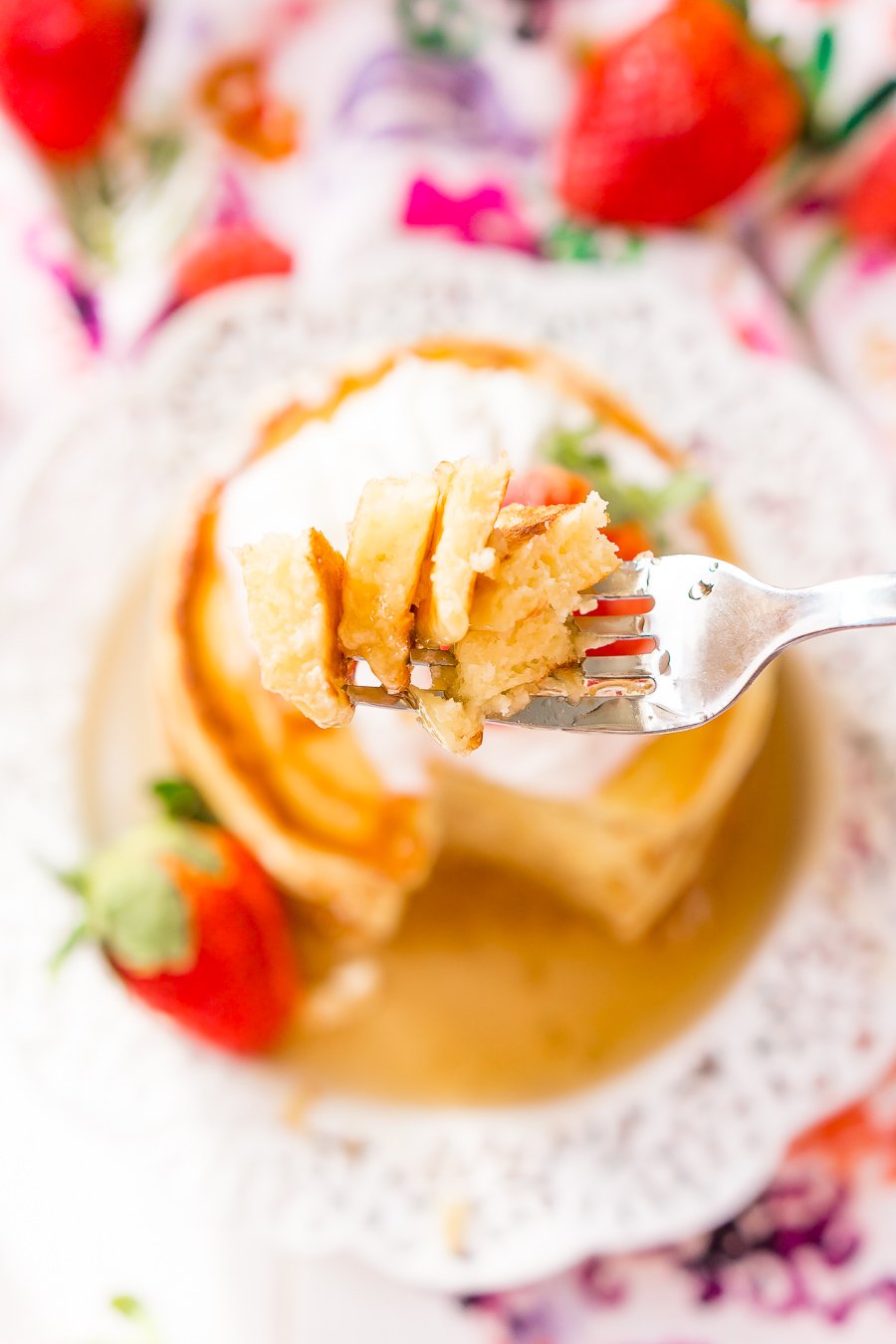 Close up of fork with pancake on it.