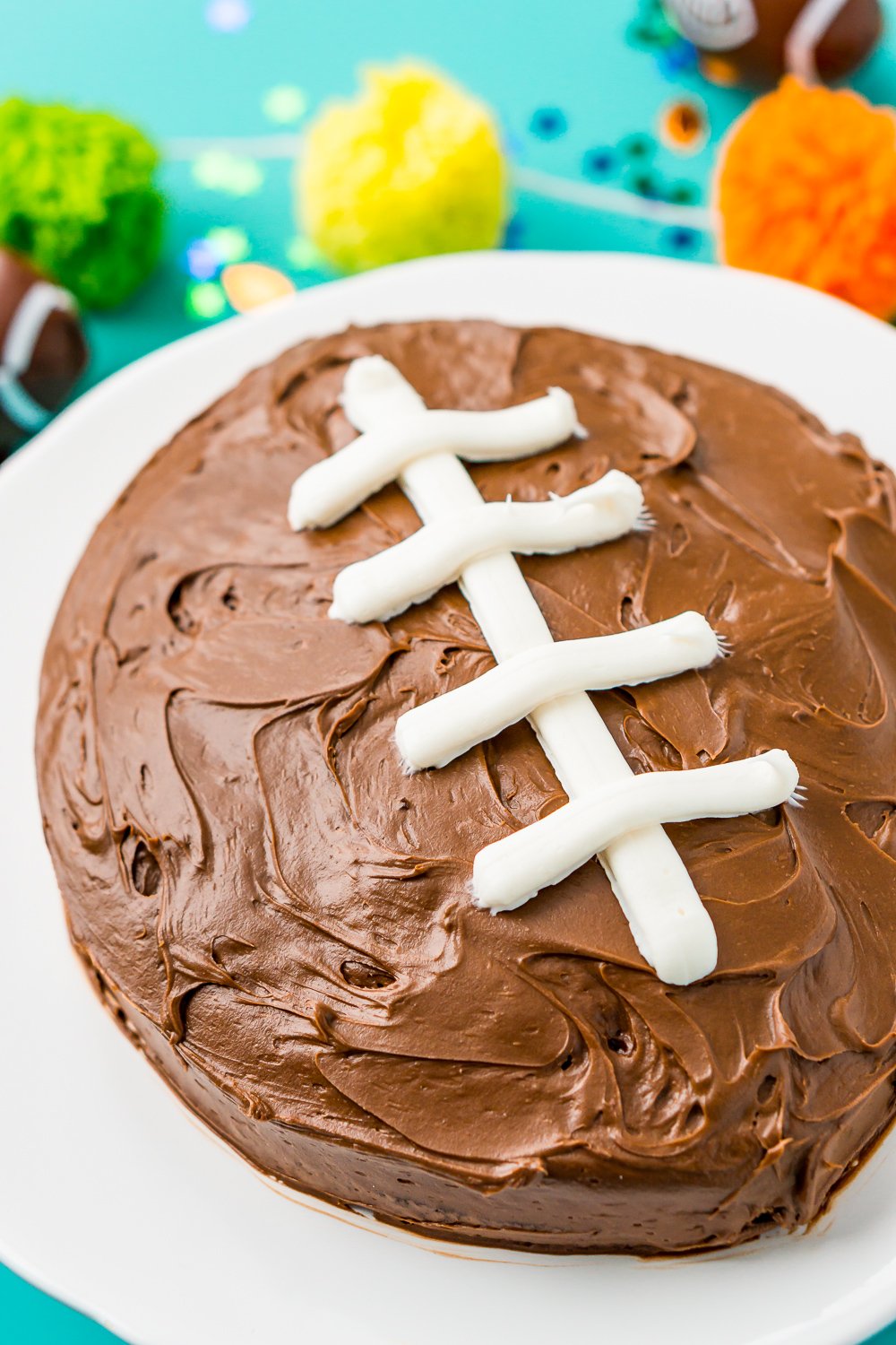 This Easy Football Cake is the perfect game day dessert! Use this simple step-by-step tutorial to make this recipe for your next football party!