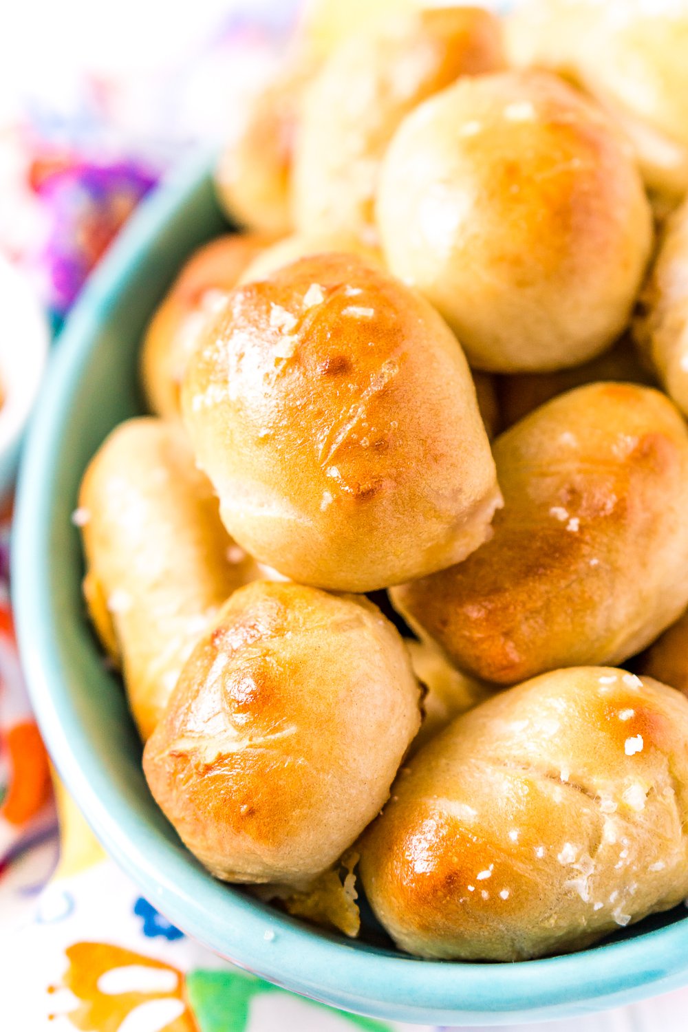 These Pretzel Pigs In A Blanket take two of your favorite party foods and combine them into one! Mini sausages and cheddar cheese wrapped in dough and baked to perfection!