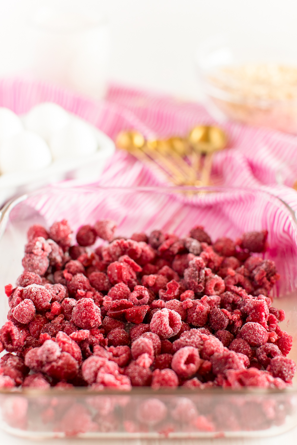 Frozen raspberries in baking dish.