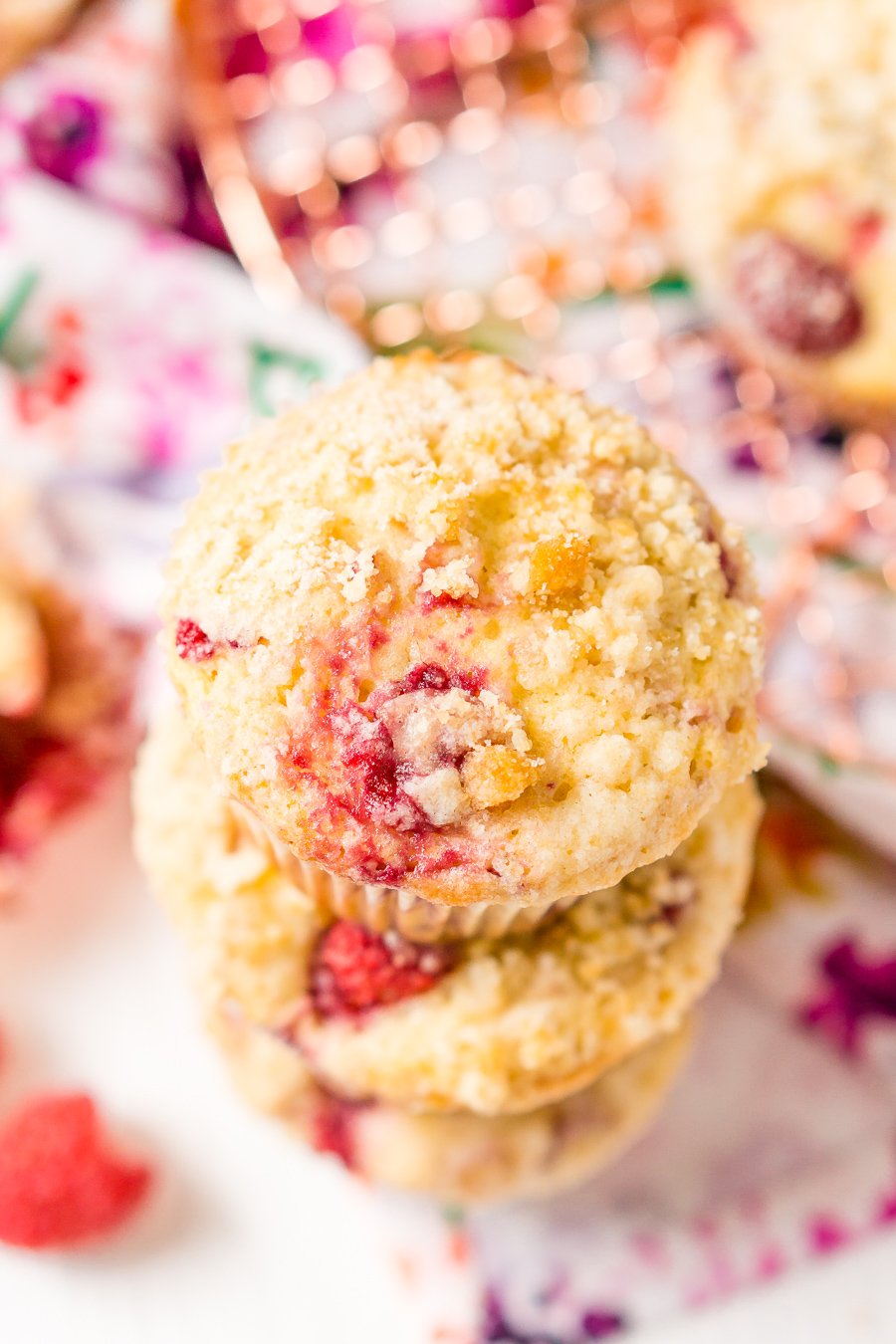 Raspberry Muffins loaded with juicy red raspberries and topped with an irresistible sugar crumble.