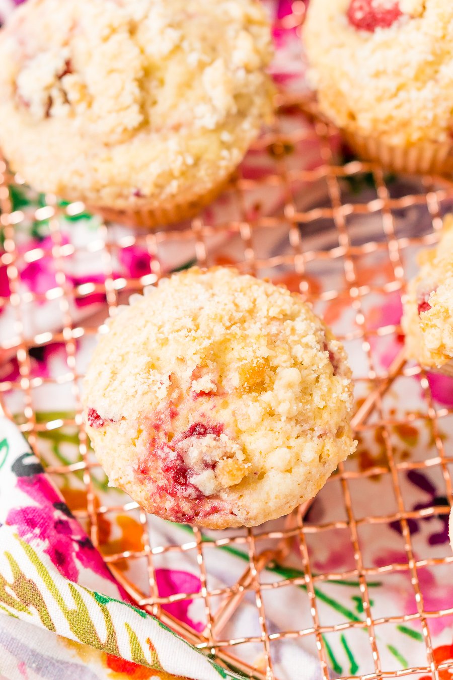 Raspberry Muffins loaded with juicy red raspberries and topped with an irresistible sugar crumble.