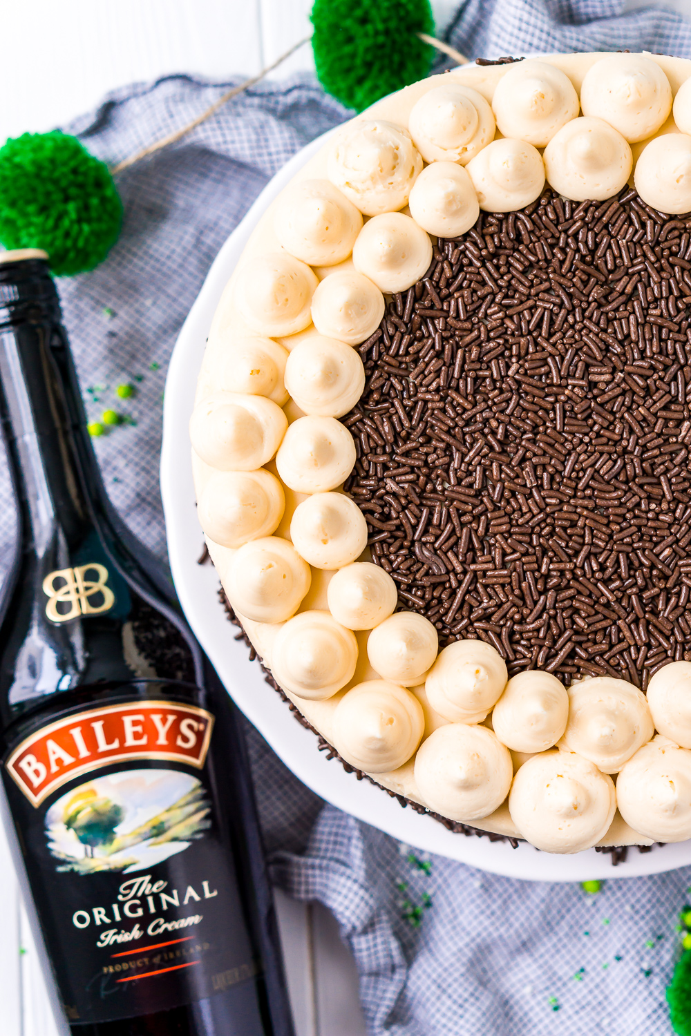 Overhead shot of Chocolate Guinness Cake with a bottle of Irish Cream Liqueur.