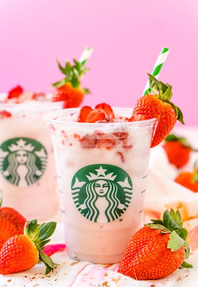 This Copycat Starbucks Pink Drink is a cheaper and just as delicious recipe to make your favorite fruity Starbucks beverage right at home with acai berry tea, coconut milk, white grape juice, simple syrup, and freeze-dried strawberries!