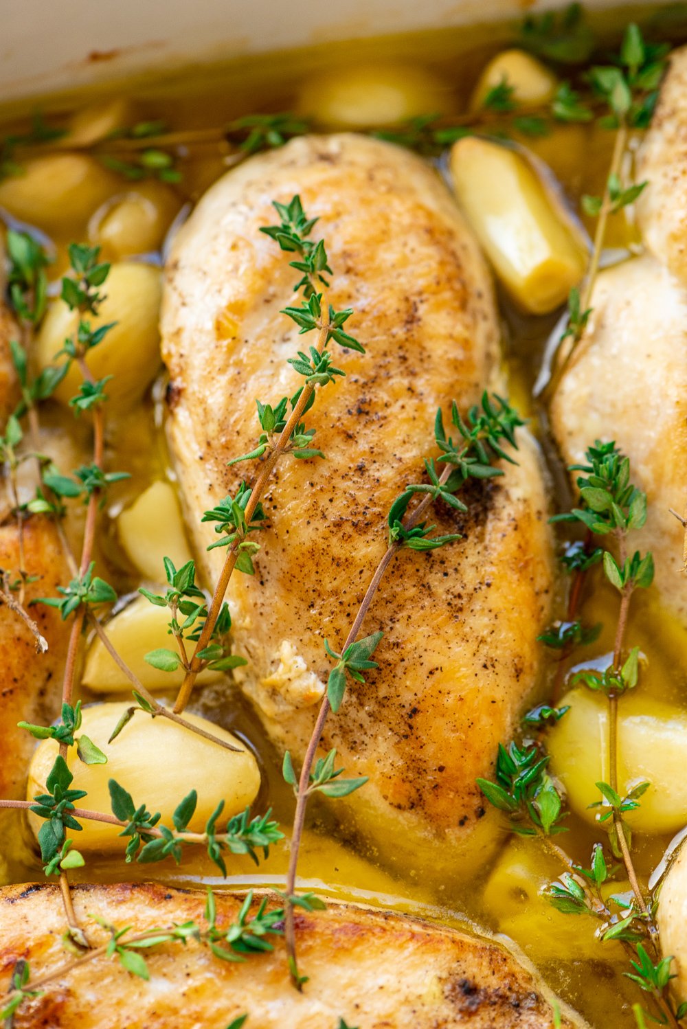 Garlic Chicken is a delicious dairy-free dinner recipe that's easy enough for weeknights and refined enough for special occasions. Made with chicken, garlic, olive oil, thyme, salt, and pepper.