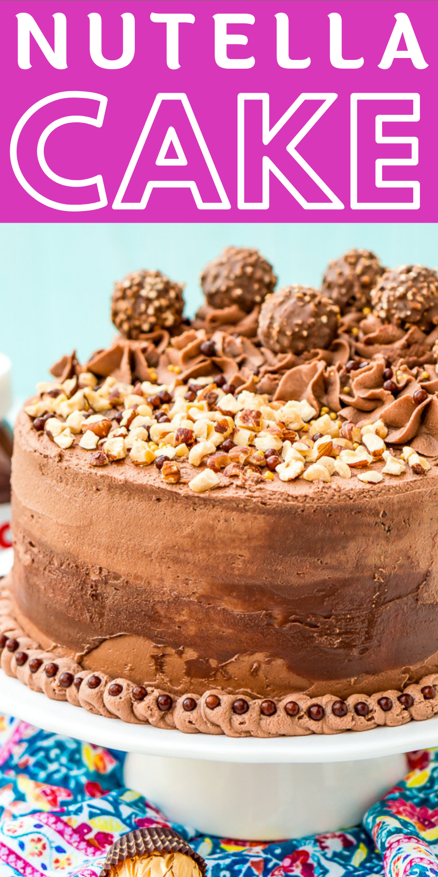 This Nutella Cake is a rich and indulgent dessert highlighting the delicious blend of chocolate and hazelnut! A moist chocolate cake coated in a decadent Nutella Frosting and topped with Ferrero Rocher candy and chopped hazelnuts. via @sugarandsoulco