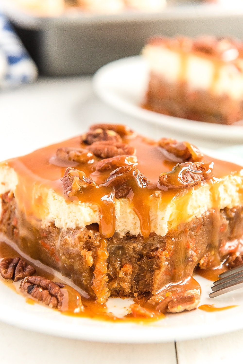 This Sea Salt Caramel Carrot Cake Poke Cake is so sweet and delicious, you'll never want any other carrot cake again! Baked to perfection and saturated in sweetened condensed milk, then topped with fluffy frosting and drenched in caramel sauce.