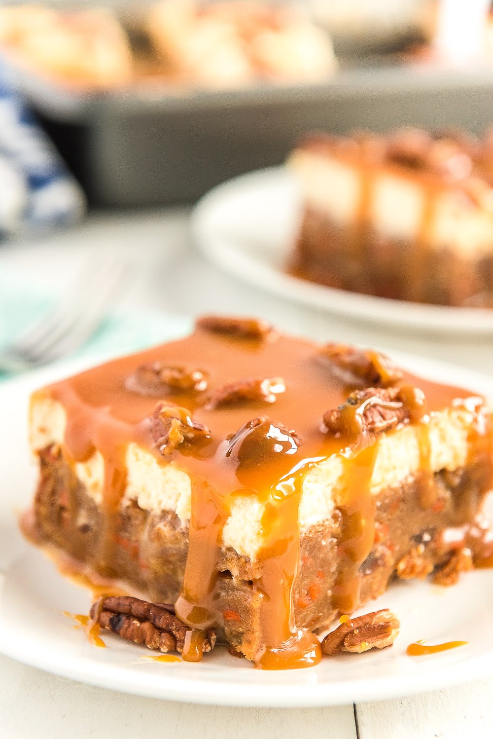 Slice of Caramel Carrot Cake on white plate.