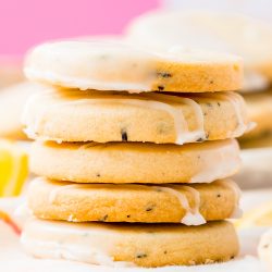 Stack of five Earl Grey Shortbread Cookies with pink background.