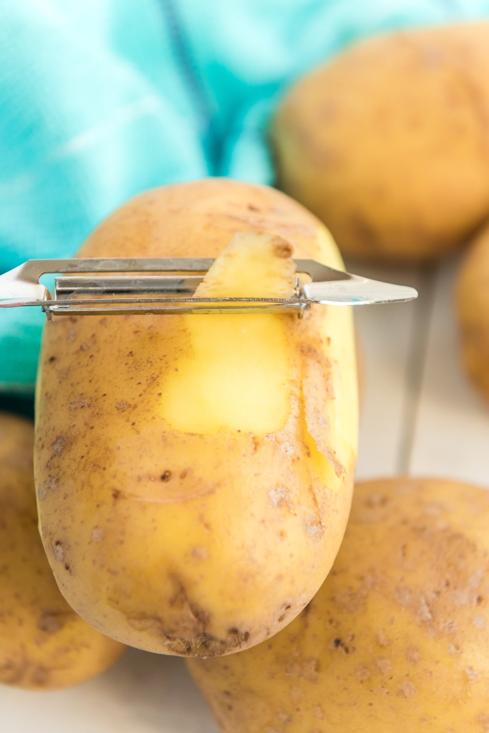 Peeling potatoes for Mashed Potatoes.