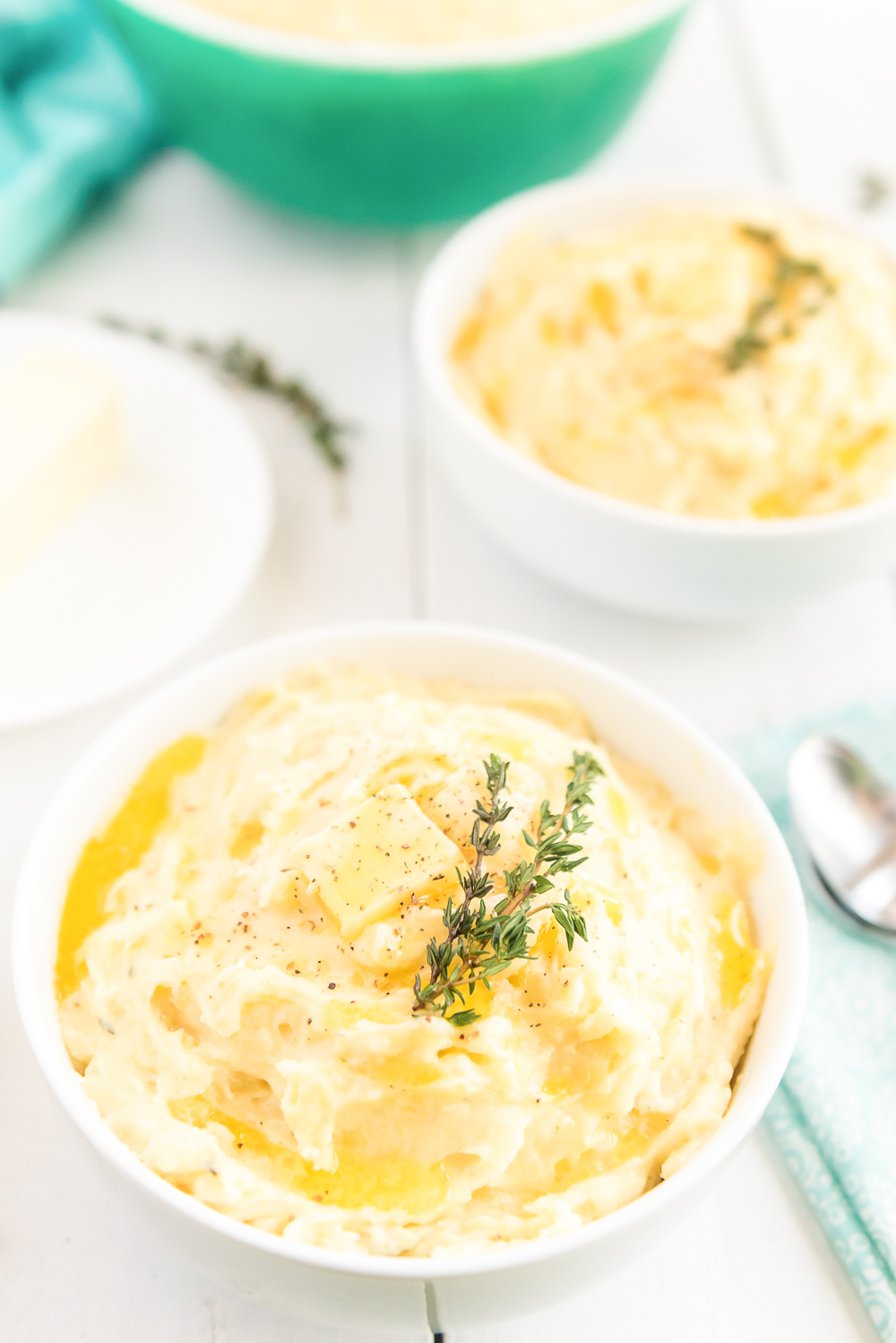 Bowl of Mashed Potatoes made with Yukon Gold, garlic, cream, butter, and thyme