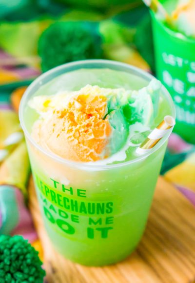 St. Patrick's Day Punch in a plastic cup that says "the leprechaun's made me do it".