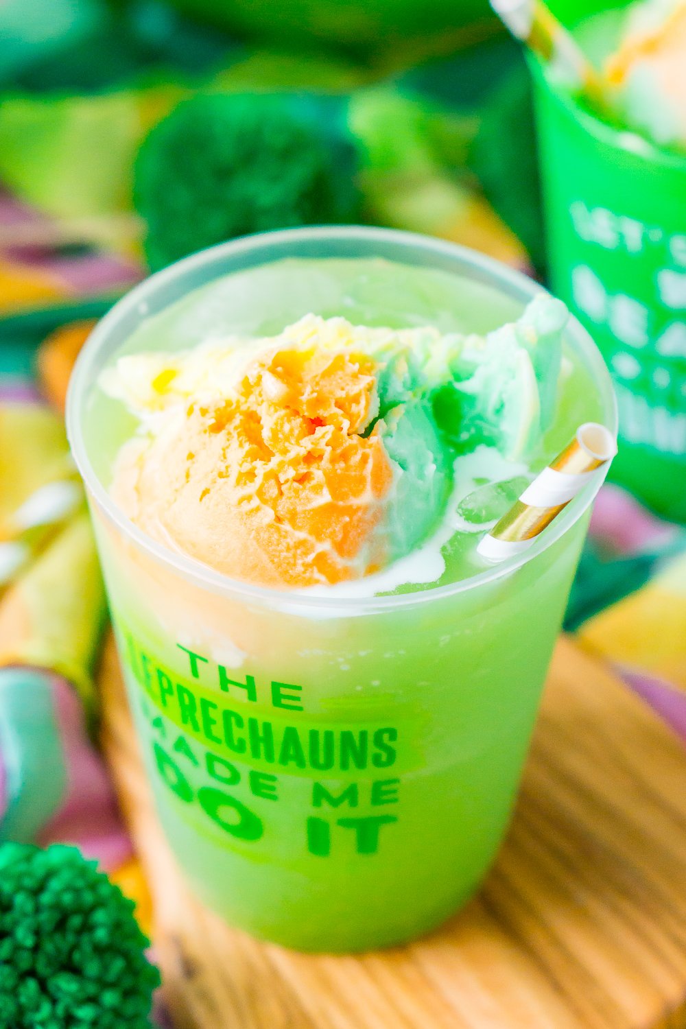 St. Patrick's Day Punch in a plastic cup that says "the leprechaun's made me do it".