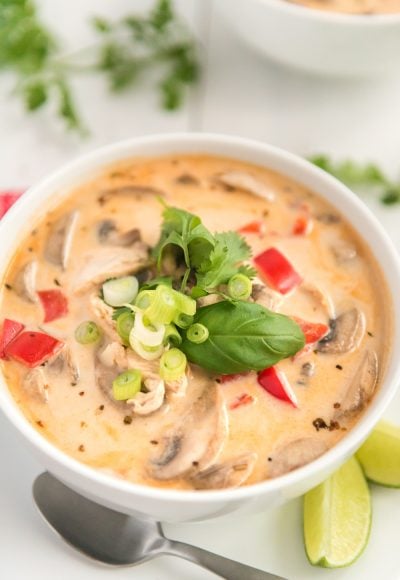 This Chicken Coconut Soup, also known as Tom Kha Gai, is an incredibly aromatic and flavorful Thai dish made with chicken, mushrooms, peppers, in a creamy coconut broth.