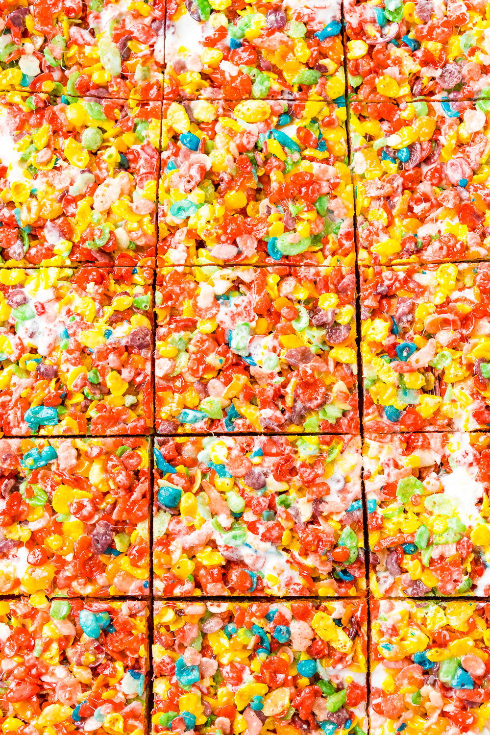 Close up of Fruity Pebbles Treats that have been sliced but not yet pulled apart.