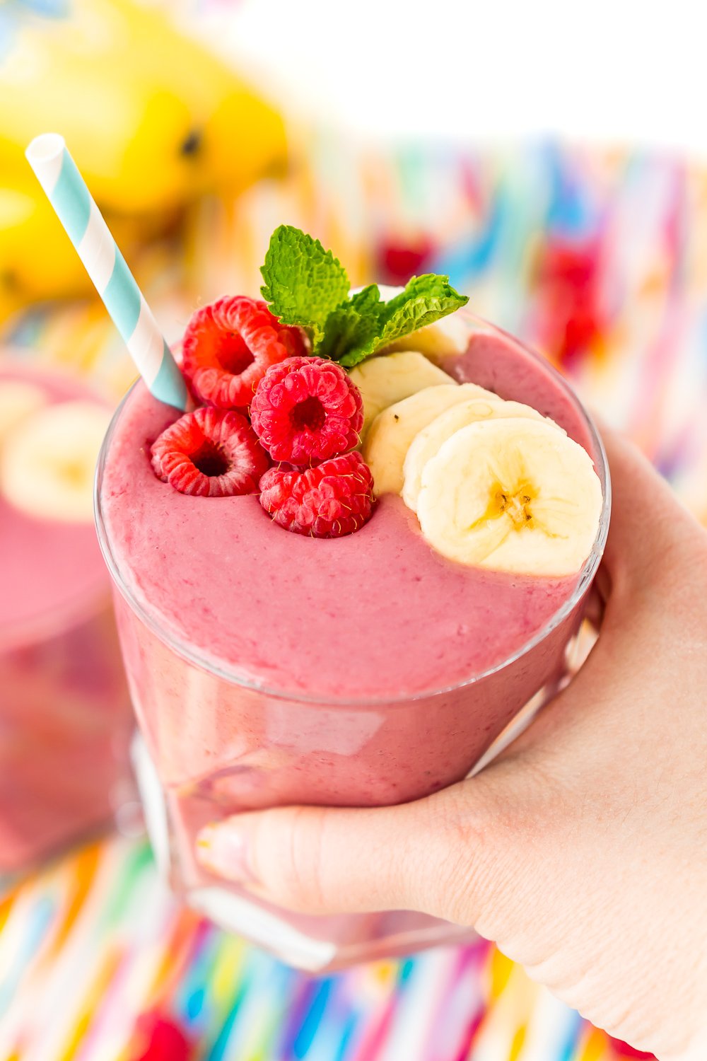 This Raspberry Banana Smoothie is a simple and delicious 5-ingredient drink recipe made with raspberries, bananas, oat milk, yogurt, and honey. A delicious snack or breakfast!