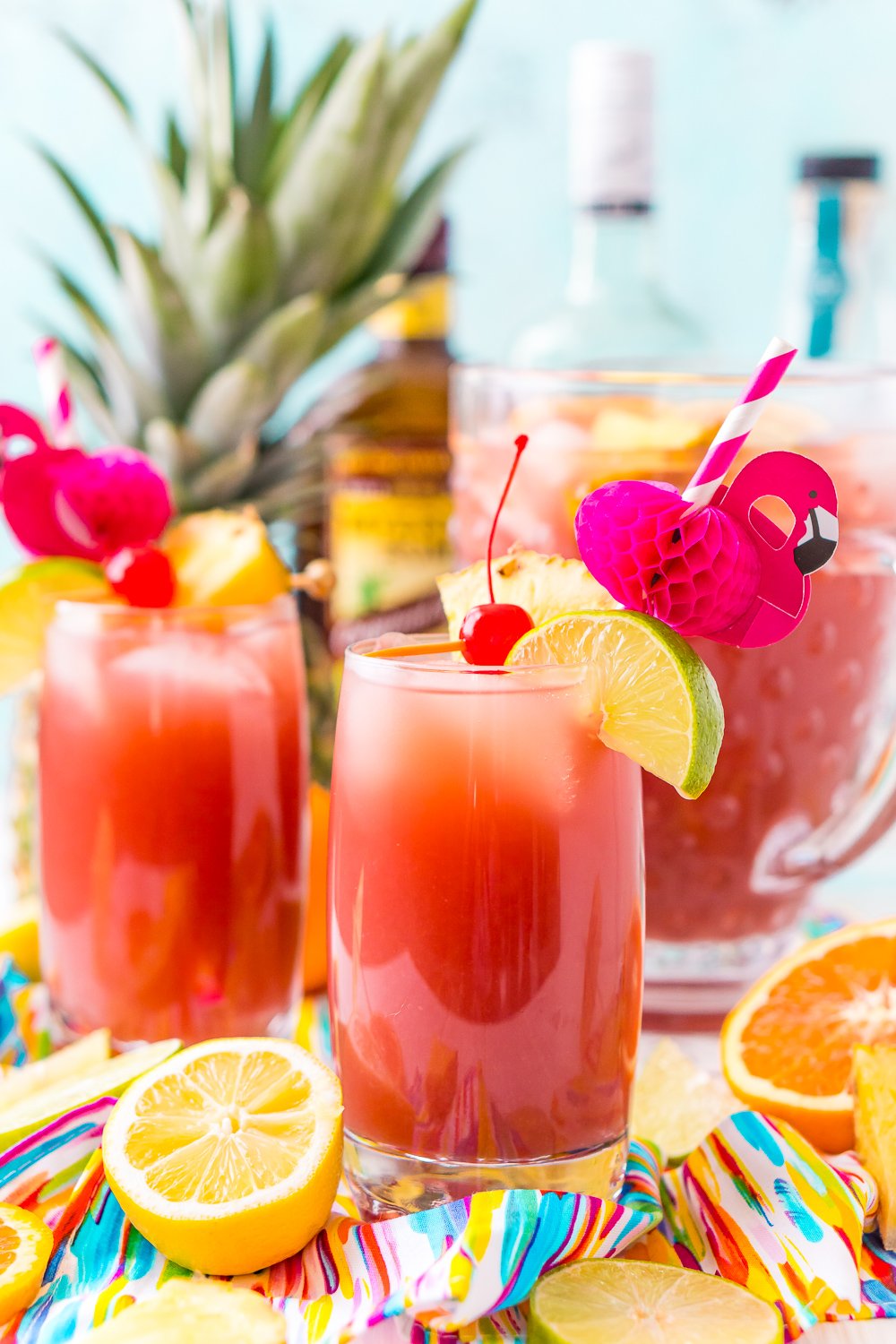 Rum Punch combines orange, pineapple, lime, and lemon juice with ginger ale and three different kinds of rum for a delicious large batch Caribbean inspired cocktail for summer parties!