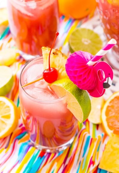 Rum Punch combines orange, pineapple, lime, and lemon juice with ginger ale and three different kinds of rum for a delicious large batch Caribbean inspired cocktail for summer parties!