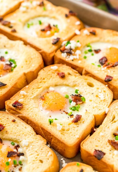 This Sheet Pan Egg In A Hole recipe is a simple way to prepare the traditional Egg-In-A-Hole breakfast dish for a crowd in less than 20 minutes!