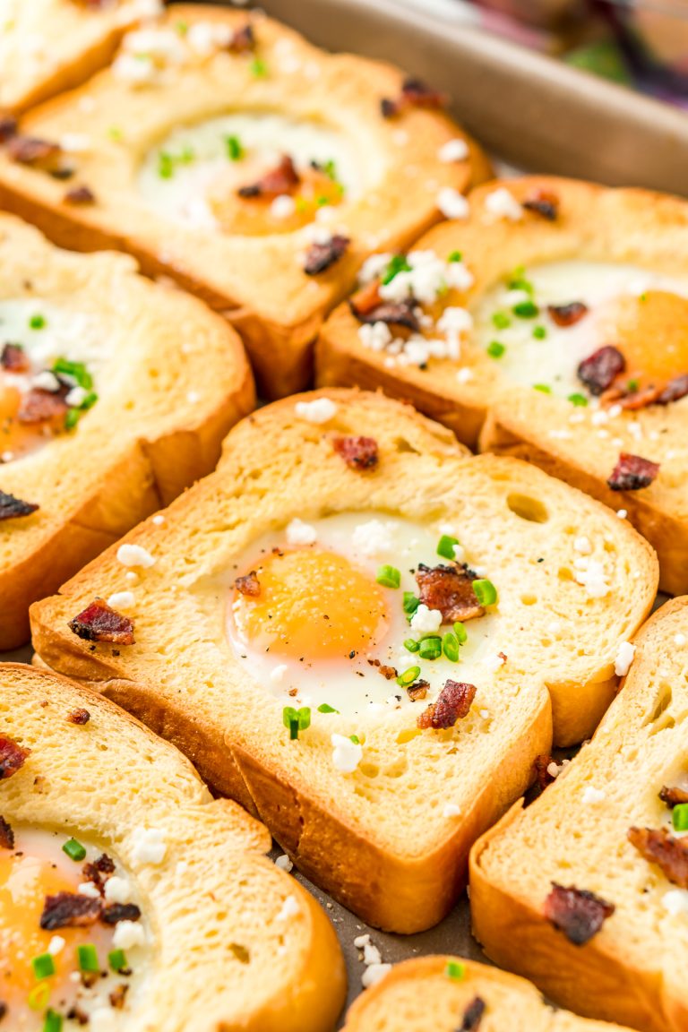 This Sheet Pan Egg In A Hole recipe is a simple way to prepare the traditional Egg-In-A-Hole breakfast dish for a crowd in less than 20 minutes!