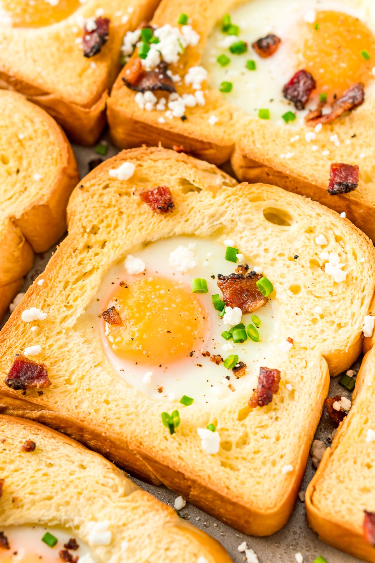 This Sheet Pan Egg In A Hole recipe is a simple way to prepare the traditional Egg-In-A-Hole breakfast dish for a crowd in less than 20 minutes!