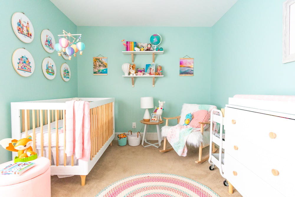 This Travel Themed Nursery is filled with simple and stylish inspiration for a baby girl's room! With custom pieces, modern furniture, and global decor!