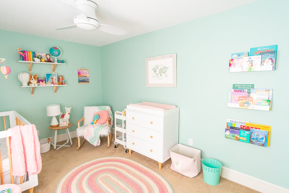 This Travel Themed Nursery is filled with simple and stylish inspiration for a baby girl's room! With custom pieces, modern furniture, and global decor!