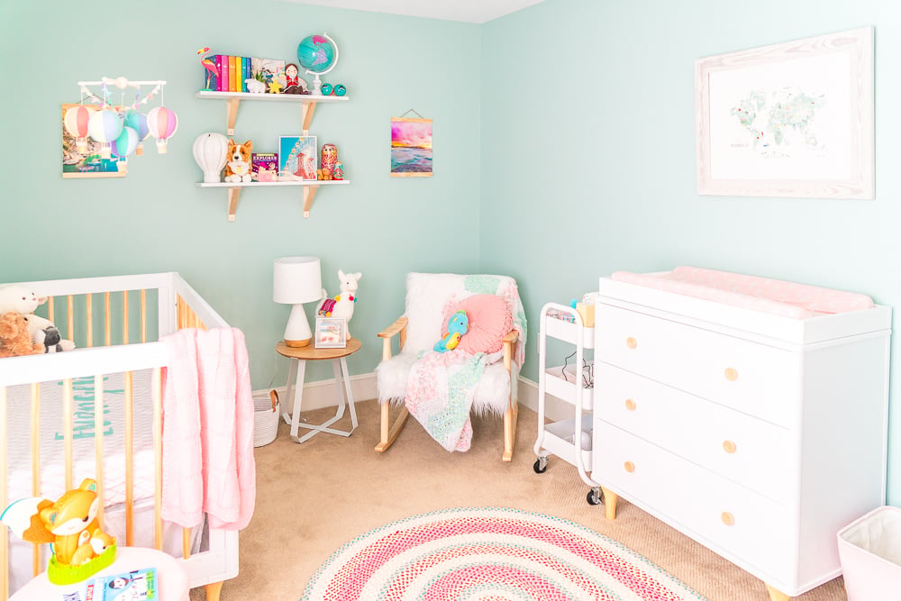 This Travel Themed Nursery is filled with simple and stylish inspiration for a baby girl's room! With custom pieces, modern furniture, and global decor!