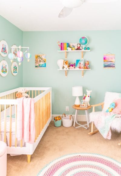 This Travel Themed Nursery is filled with simple and stylish inspiration for a baby girl's room! With custom pieces, modern furniture, and global decor!