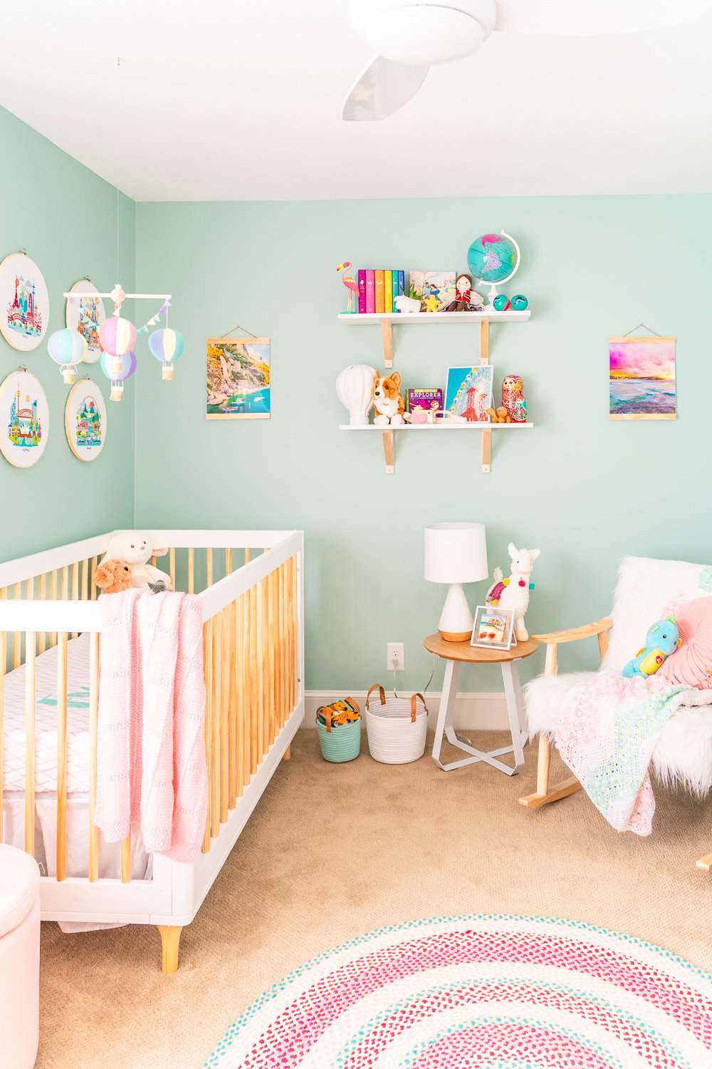 This Travel Themed Nursery is filled with simple and stylish inspiration for a baby girl's room! With custom pieces, modern furniture, and global decor!