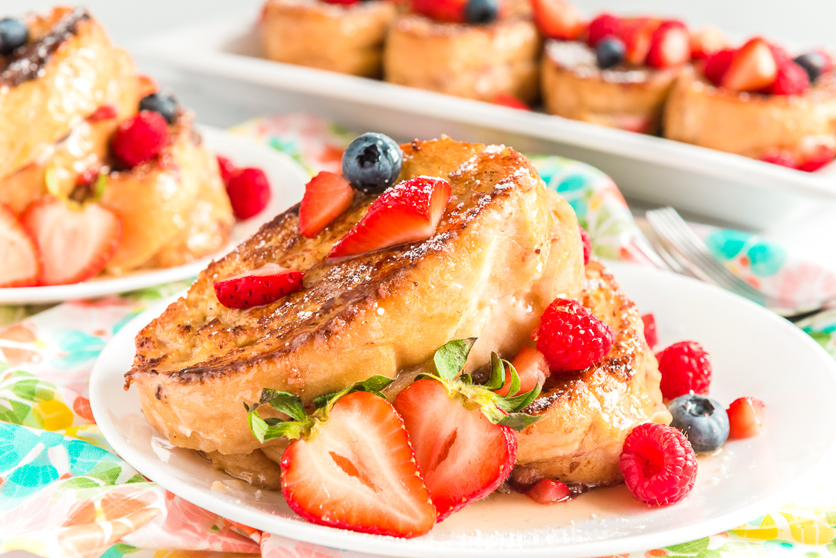 Berry Stuffed French Toast is a fruity, creamy, and indulgent breakfast recipe that combines macerated berries with a sweet mascarpone mixture and thick slices of French bread.