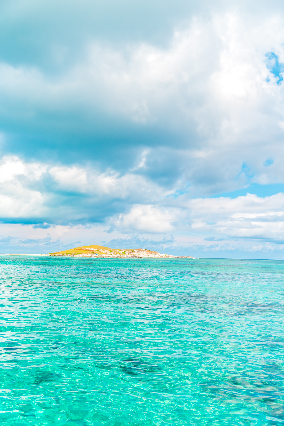 Island in the Caribbean. Blue skies and water around it.