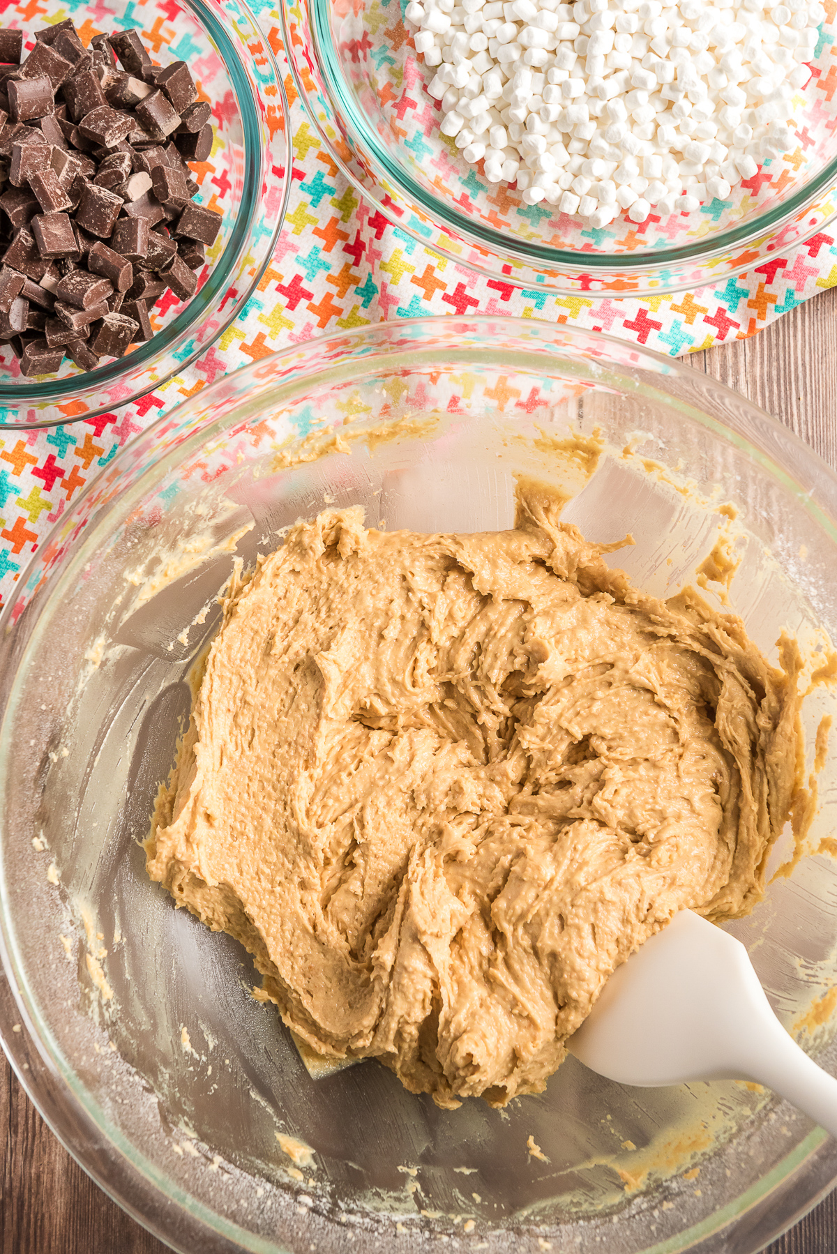 Cookie dough in a glass mixing bowl.