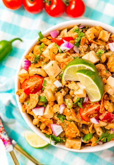 Overhead shot of a pasta salad in a white bowl with taco flavors.