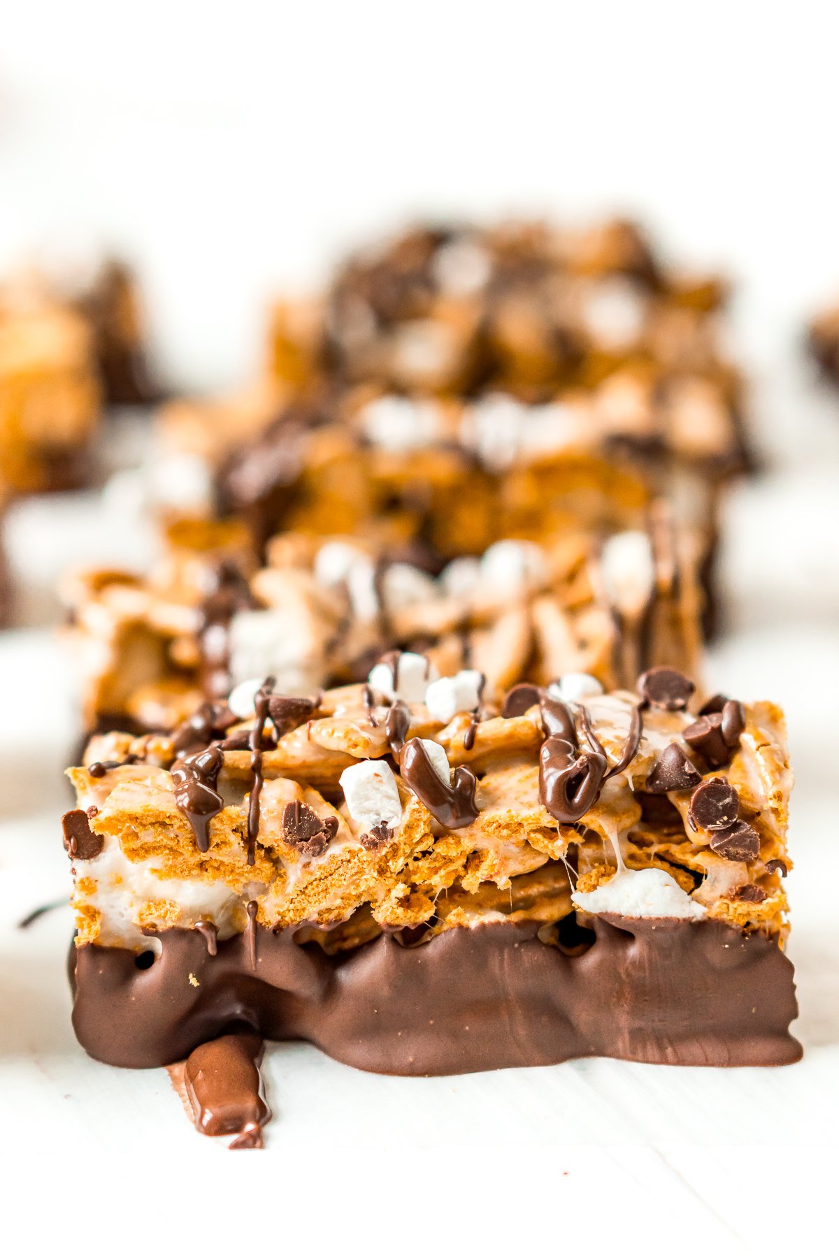 S'mores Bars lined up on wax paper.