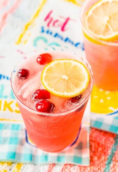 Cranberry lemonade on paper napkin on a beach blanket