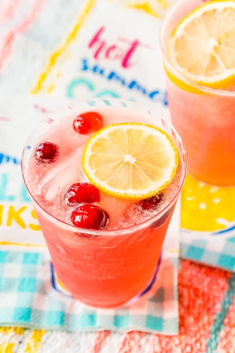 Cranberry lemonade on paper napkin on a beach blanket