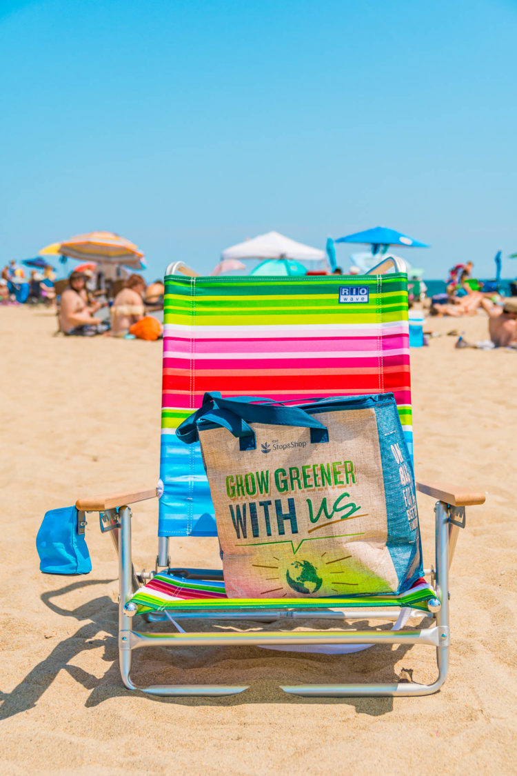 Colorful beach chair with a reusable Stop & Shop grocery bag on it.