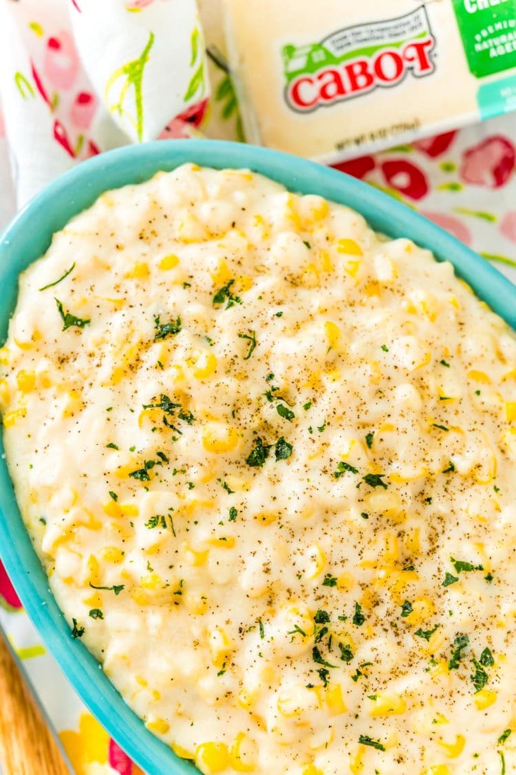 Close up photo of a bowl of cheesy corn.