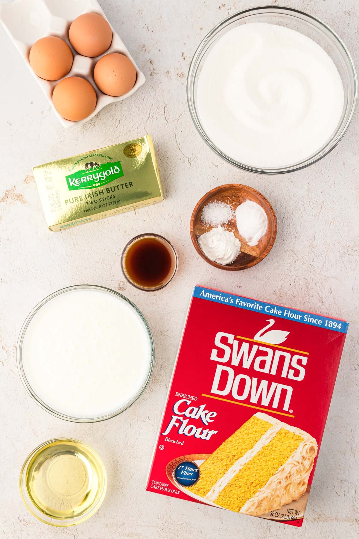 Ingredients to make yellow butter cake on a counter.