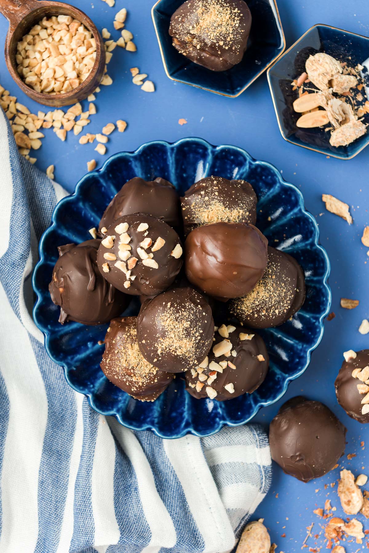 Overhead photo of a blue plate with peanut butter balls on it.