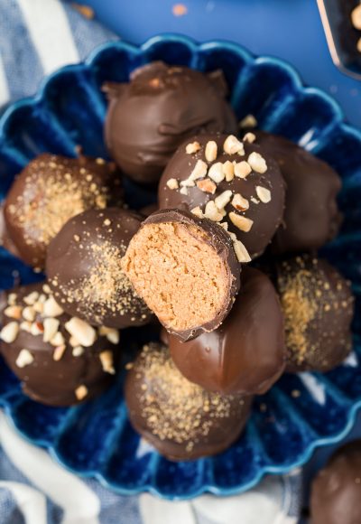 Overhead photo of a blue plate with peanut butter balls on it.